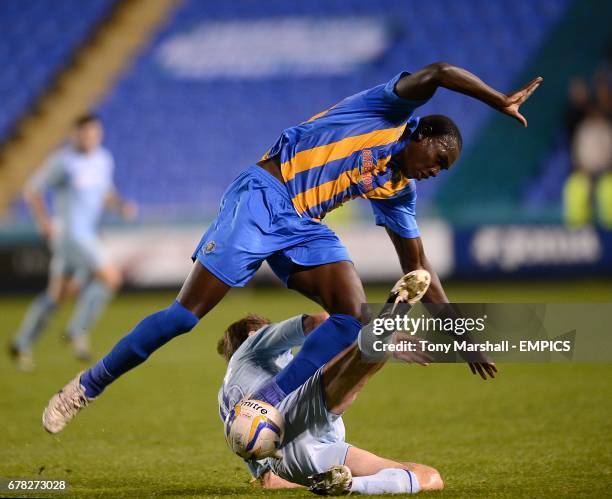 Coventry City's Kevin Kilbane slides in on Shrewsbury Town's Jermaine Grandison