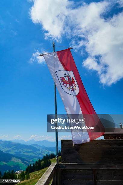 Tyrolian Ensign Flag is blowing in the Wind in the Mountains on August 05, 2015 in Hopfgarten, Tyrol, Austria.
