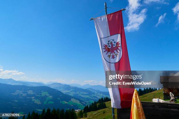Tyrolian Ensign Flag is blowing in the Wind in the Mountains on August 05, 2015 in Hopfgarten, Tyrol, Austria.