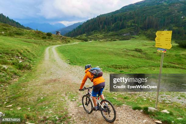 Mountainbiker is riding a Track in the Tyrolian Mountains on August 21, 2015 in Hopfgarten, Tyrol, Austria.