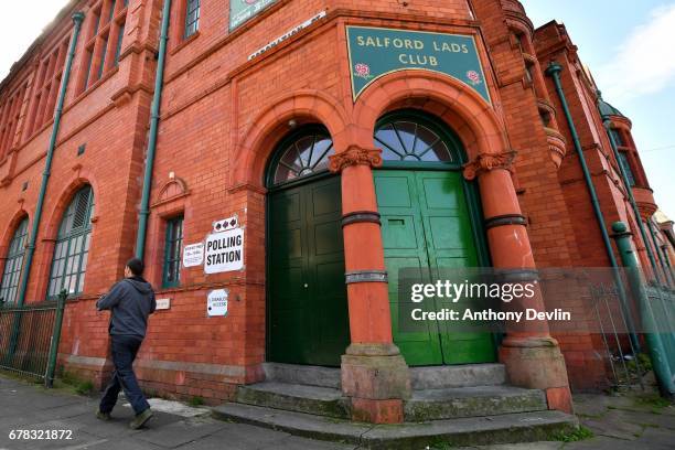 Voters arrive at Salford Lads Club on Coronation Street in Salford to cast their votes in the Manchester Mayoral election on May 4, 2017 in...
