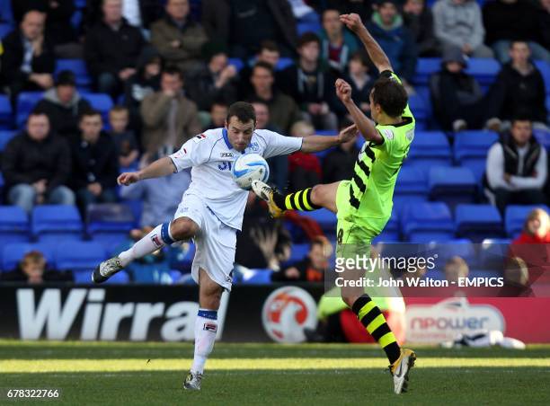 Tranmere Rovers' Danny Holmes battles for possession of the ball with Yeovil Town's Ed Upson