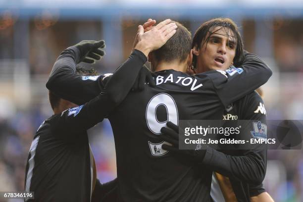 Fulham's Dimitar Berbatov celebrates scoring his team's third goal with his team-mate Bryan Ruiz