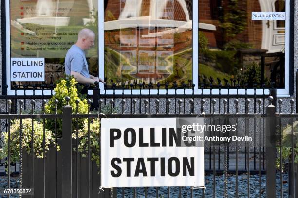 Voter arrives at a polling station at Carr & Hume estate agents in Swinton during the Manchester Mayoral election on May 4, 2017 in Manchester,...