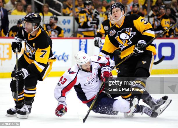 Olli Maatta of the Pittsburgh Penguins collides with Tom Wilson of the Washington Capitals in Game Four of the Eastern Conference Second Round during...