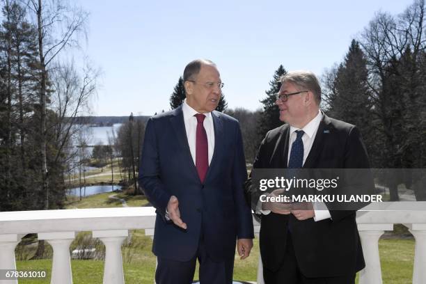 Russian Foreign Minister Sergei Lavrov and his Finnish counterpart Timo Soini talk following their press conference during their meeting at Hotel...