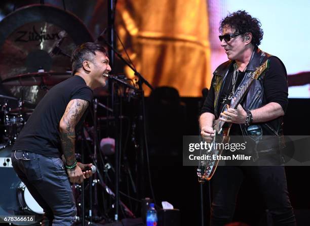 Singer Arnel Pineda and guitarist Neal Schon of Journey perform during the first night of the band's second nine-show residency at The Joint inside...