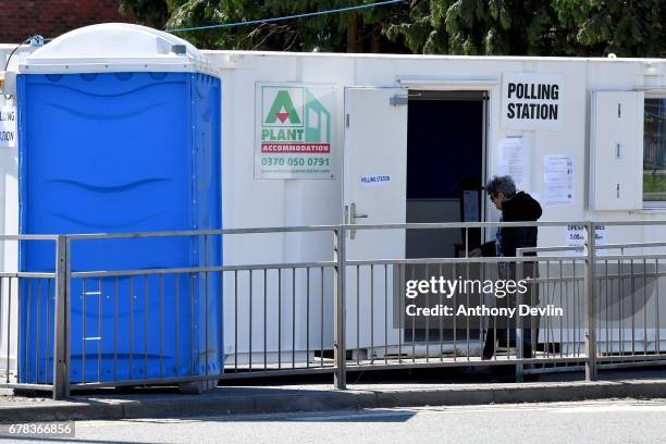 Voter arrives at a polling station situated in a shipping container on the East Lancashire road near Swinton during the Manchester Mayoral election...