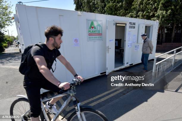 Voter arrives at a polling station situated in a shipping container on the East Lancashire road near Swinton during the Manchester Mayoral election...