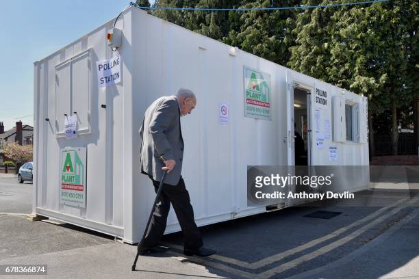 Voter arrives at a polling station situated in a shipping container on the East Lancashire road near Swinton during the Manchester Mayoral election...