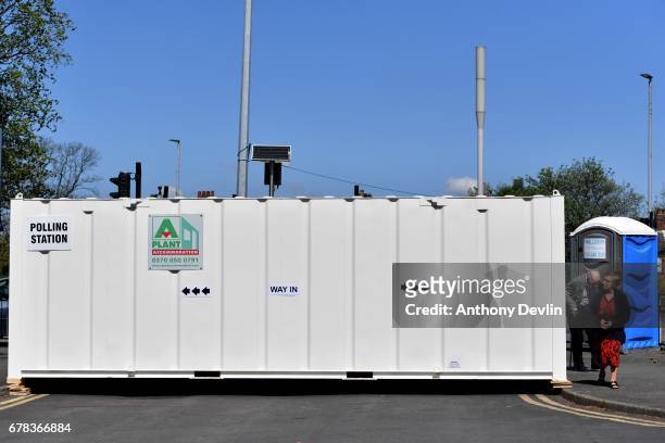 Voters arrive at a polling station situated in a shipping container on the East Lancashire road near Swinton during the Manchester Mayoral election...