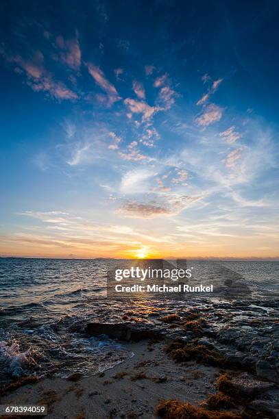 sunset over the ocean, beachcomber island, mamanucas islands, fiji, south pacific, pacific - beachcomber island stock pictures, royalty-free photos & images