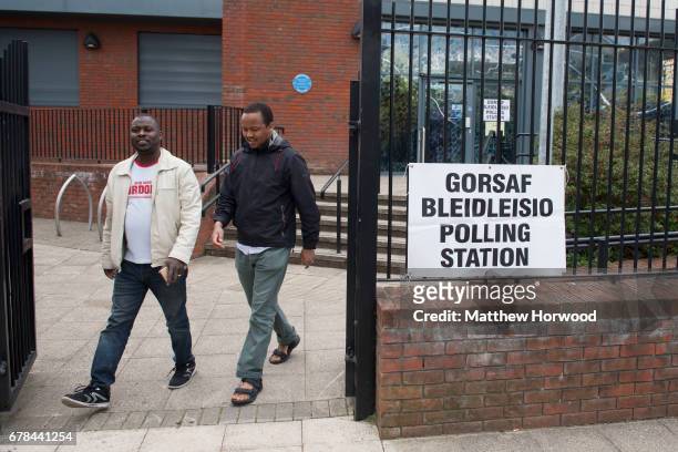 Two men leave Butetown Community Centre during the local council elections on May 4, 2017 in Butetown, Cardiff, Wales. A total of 4,851 council seats...