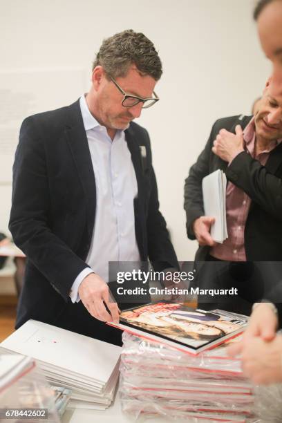 Kai Diekmann, former chief editor of German Boulevard Magazin 'BILD' poses for the media during the 'Foto.Kunst.Boulevard' exhibition preview and...