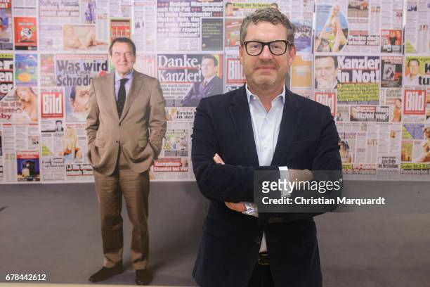 Kai Diekmann, former chief editor of German Boulevard Magazin 'BILD' poses for the media during the 'Foto.Kunst.Boulevard' exhibition preview and...