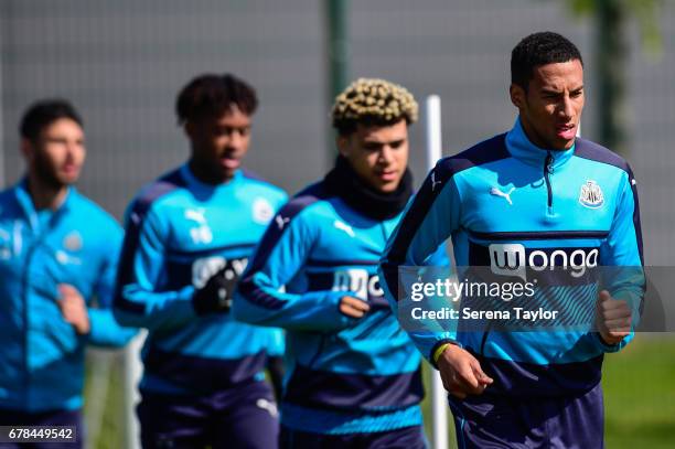 Newcastle players seen R-L Isaac Hayden, DeAndre Yedlin, Rolando Aarons and Achraf Lazaar warm up during the Newcastle United Training Session at The...