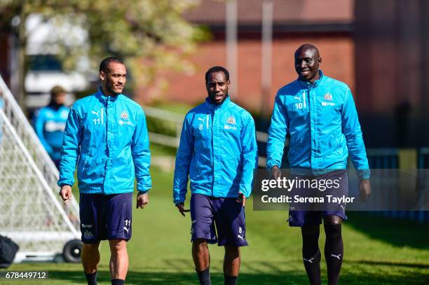 Yoan Gouffran , Vurnon Anita and Mohamed Diame walk outside during the Newcastle United Training Session at The Newcastle United Training Centre on...