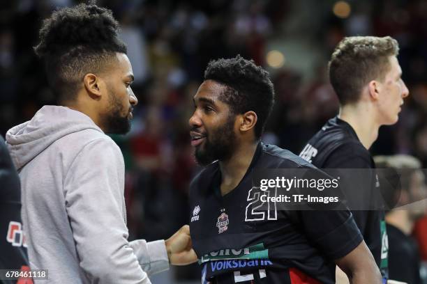 Evans Dwayne of Giessen 46ers shakes hands with Jahenns Manigat of Giessen 46ers during the match between FC Bayern Muenchen and Giessen 46ers at...