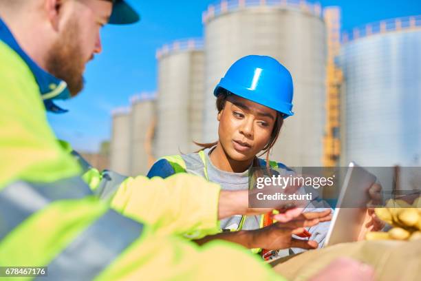 discussing the problem - hard hat ipad stock pictures, royalty-free photos & images