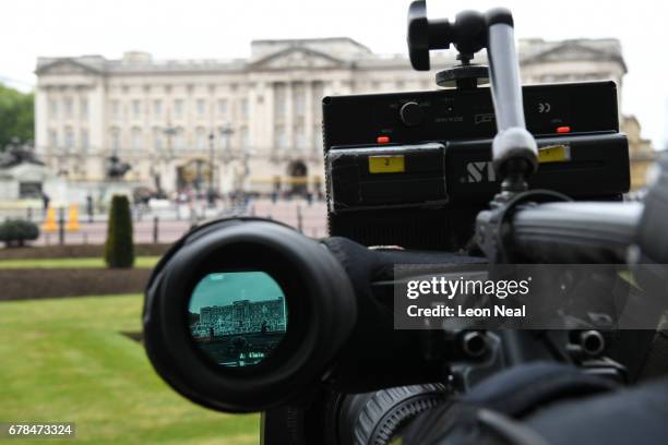 View of Buckingham Palace is seen through the finder of a TV camera as media await the return of Queen Elizabeth II and Prince Philip, Duke of...