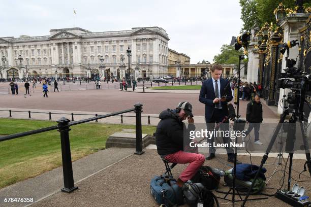 Media wait near Buckingham Palace for the return of Queen Elizabeth II and Prince Philip, Duke of Edinburgh after a service for members of The Order...
