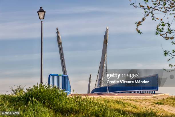 pedestrian bridge and street lamp - barriada stock-fotos und bilder