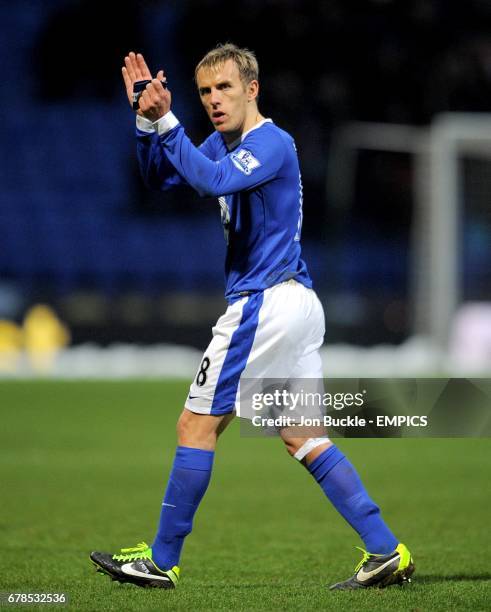 Everton's Phil Neville applauds the fans after the game