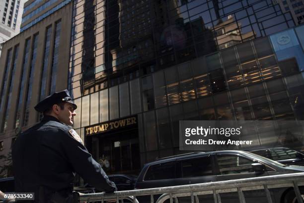 New York City Police officer patrols across the street from Trump Tower, May 4, 2017 in New York City. President Donald Trump is returning to New...