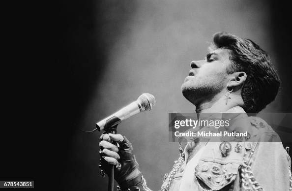 George Michael Instruments English singer and songwriter George Michael performing on stage ...