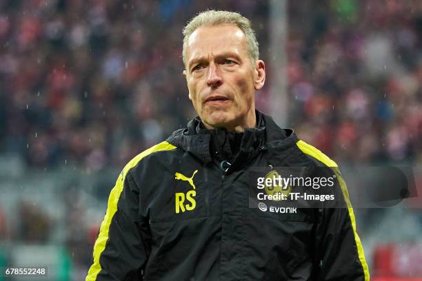 Athletic coach Rainer Schrey of Dortmund looks on during the German Cup semi final soccer match between FC Bayern Munich and Borussia Dortmund at the...