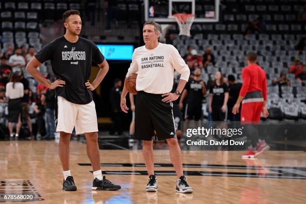 Kyle Anderson and Chip Engelland of the San Antonio Spurs talk during warm ups before Game Two of the Eastern Conference Semifinals against the...