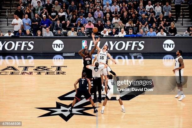 Clint Capela of the Houston Rockets and Pau Gasol of the San Antonio Spurs go up for the opening tip off before Game Two of the Eastern Conference...