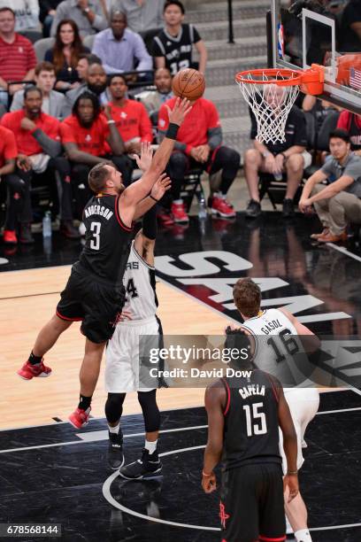 Ryan Anderson of the Houston Rockets drives to the basket and shoots the ball against the San Antonio Spurs during Game Two of the Eastern Conference...