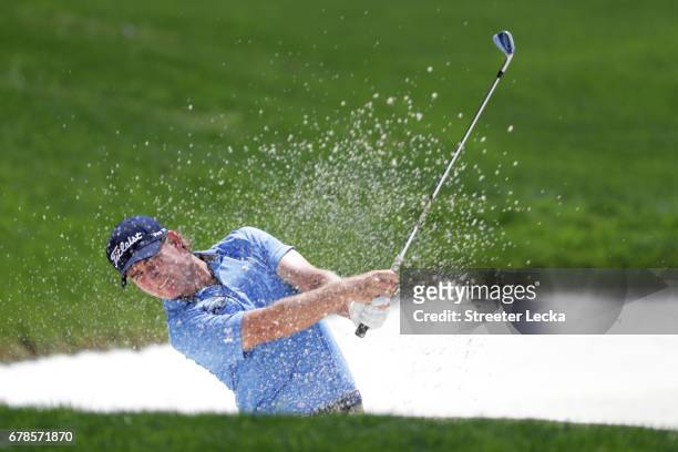 John Peterson plays a shot from a bunker on the sixth hole during round one of the Wells Fargo Championship at Eagle Point Golf Club on May 4, 2017...