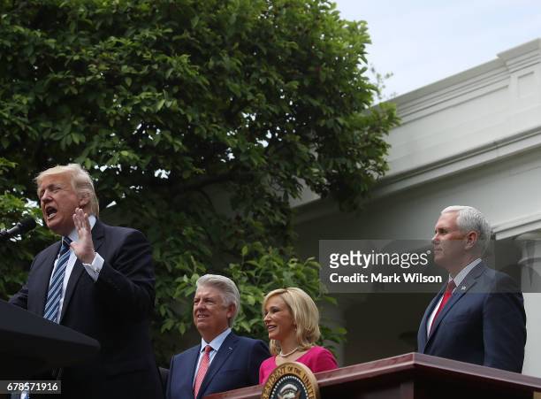 President Donald Trump , speaks while by Vice President Mike Pence , Pastor Paula White , and Pastor Jack Graham, during a National Day of Prayer...