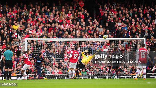 Blackburn Rovers' goalkeeper Jake Kean saves from Arsenal's Vassiriki Diaby