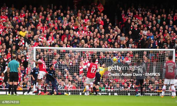 Blackburn Rovers' goalkeeper Jake Kean saves from Arsenal's Vassiriki Diaby