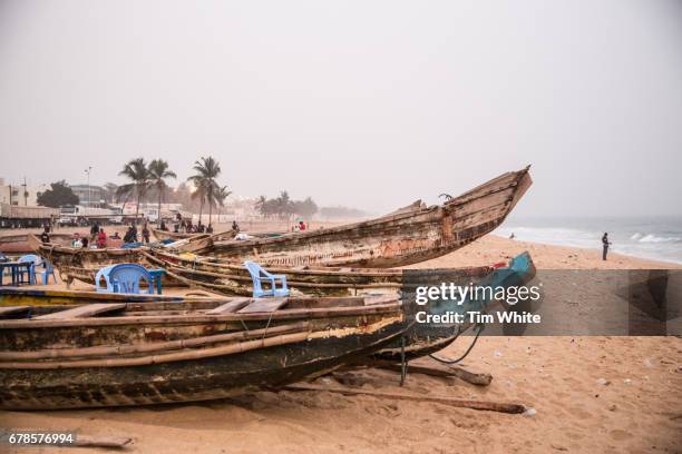 fishing boats on beach, lome , togo, africa - togo stock pictures, royalty-free photos & images