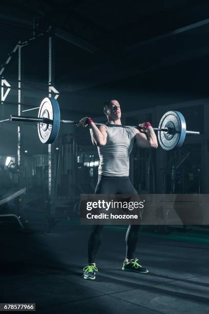 young man doing exercise with weights - deadlift stock pictures, royalty-free photos & images