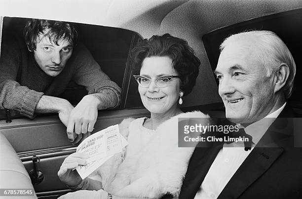 English actor Terence Stamp sees his parents Ethel and Thomas off to the London premiere of his latest film 'Modesty Blaise', UK, 5th May 1966.