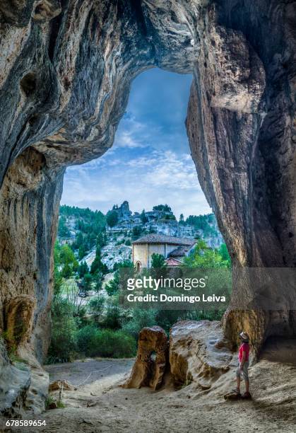 view of saint bartholomew hermitage from a cave in rio lobos canyon in soria province, spain - soleado stockfoto's en -beelden