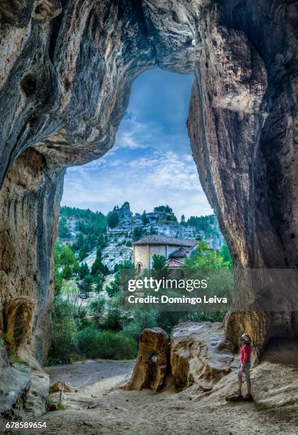 view of saint bartholomew hermitage from a cave in rio lobos canyon in soria province, spain - acantilado - fotografias e filmes do acervo