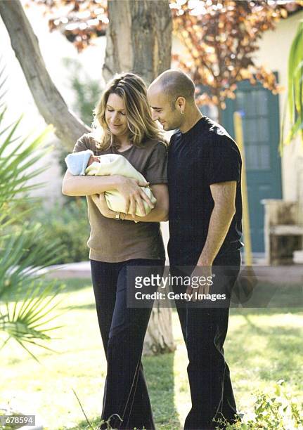 Tennis players Andre Agassi and Steffi Graf hold their new son Jaden Gil October 27, 2001 in Las Vegas, NV. Their baby weighed five pounds fourteen...