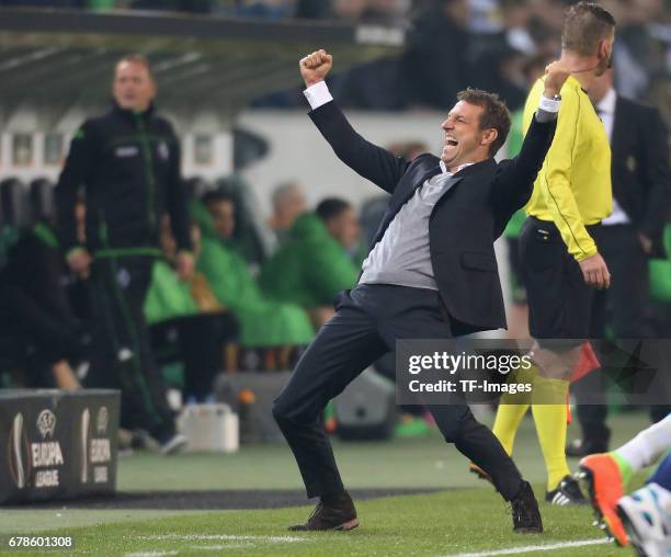 Head coach Markus Weinzierl of Schalke celebrate their win after the UEFA Europa League Round of 16 second leg match between Borussia...
