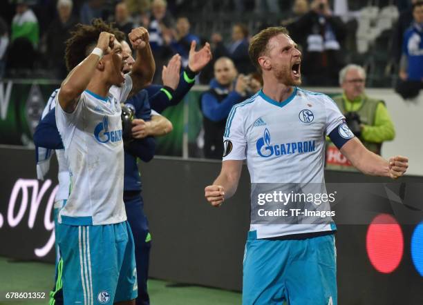 Benedikt Hoewedes of schalke and Thilo Kehrer of Schalke celebrate their win during the UEFA Europa League Round of 16 second leg match between...