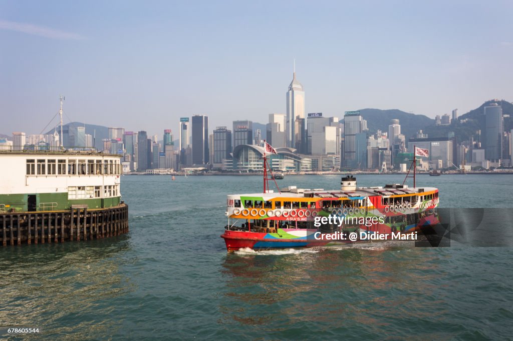 A star ferry reaching the Tsim Sha Tsui pier in Kowloon, Hong Kong