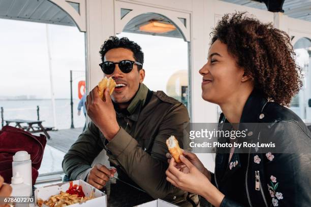 seaside couples - fish and chips stock pictures, royalty-free photos & images