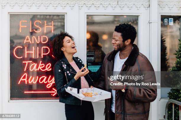 seaside couples - couple eating stock pictures, royalty-free photos & images