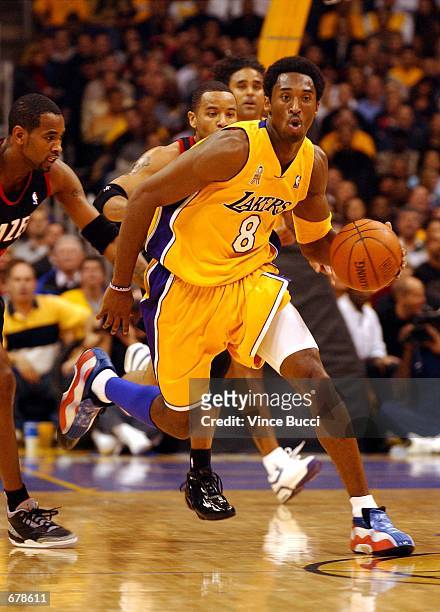 Laker's Kobe Bryant wears a pair of red, white and blue shoes during the Los Angeles Lakers versus the Portland Trail Blazers basketball game October...