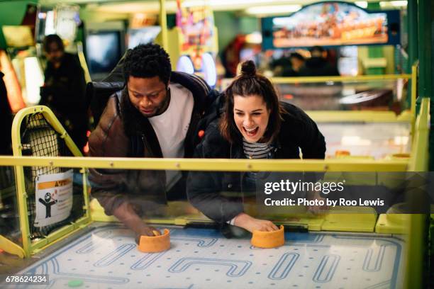 seaside couples - arcade stock-fotos und bilder